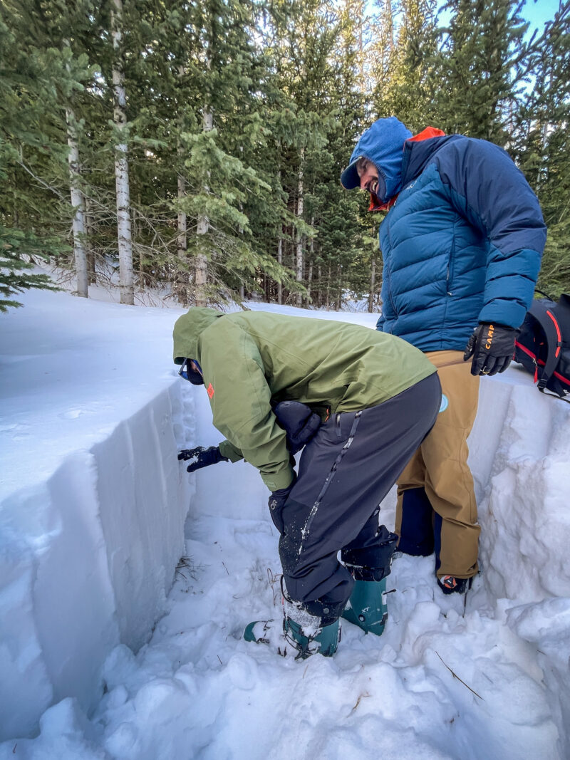 Instructor demonstrating snowpack layers in an AIARE Level 1 course.