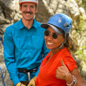 Rock Guide demonstrating belay techniques to beginners.